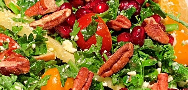 The most delicious healthy Christmas kale salad with pomegranate seeds, pecans, and more for your holiday dinner!